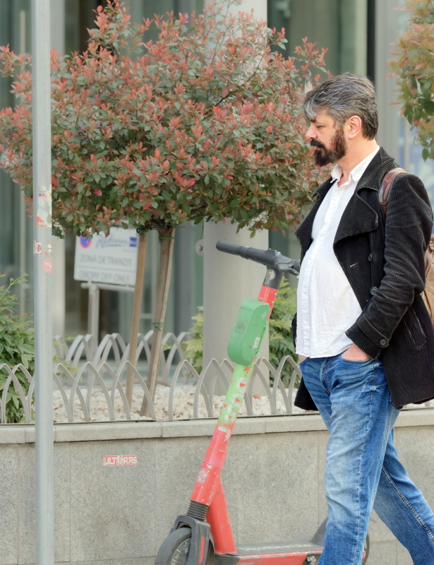 Young bearded man walking